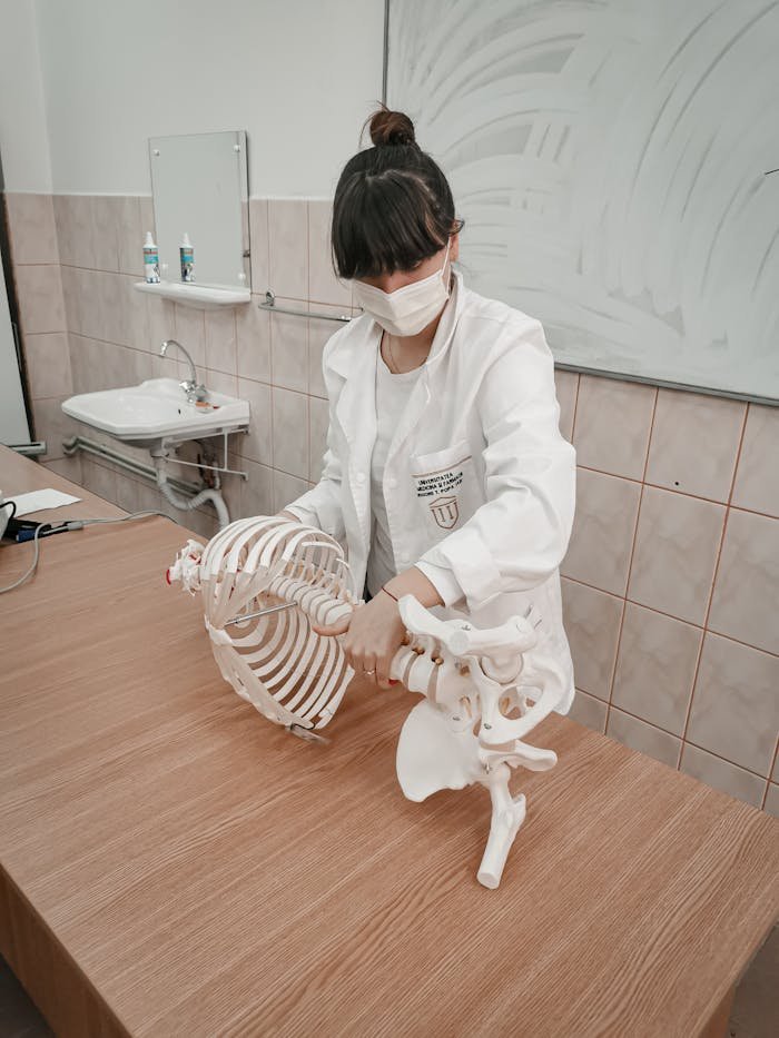 Woman Holding a Human Skeleton 